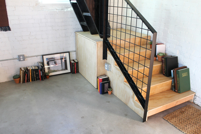 metal staircase railing and concrete floors