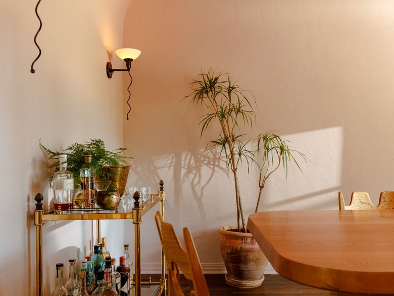 dining room with fully stocked bar cart