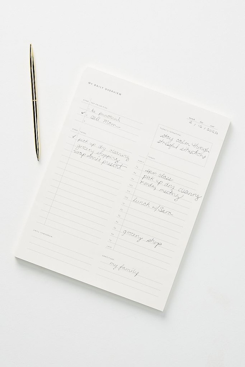 notepad with pen nearby