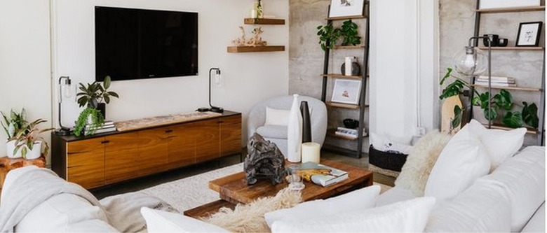 living room with couch and wall shelves for Apartment decorating ideas