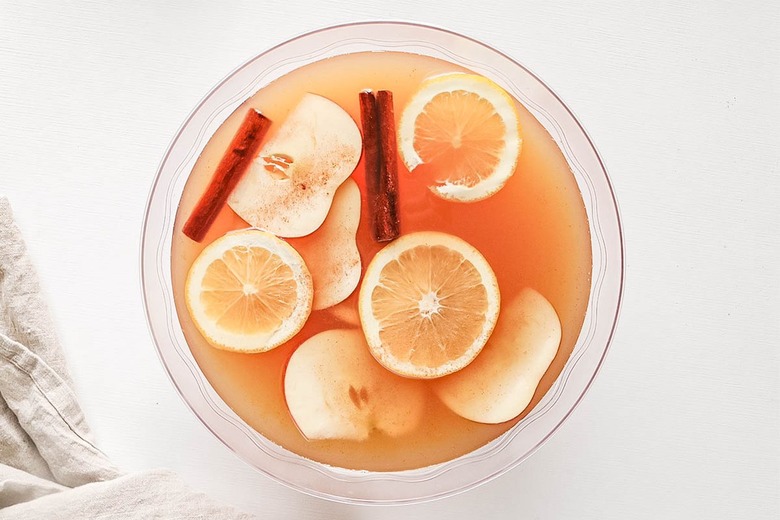 Garnish punch with cinnamon sticks