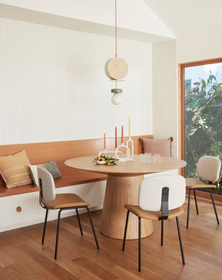 round wooden dining table in kitchen nook