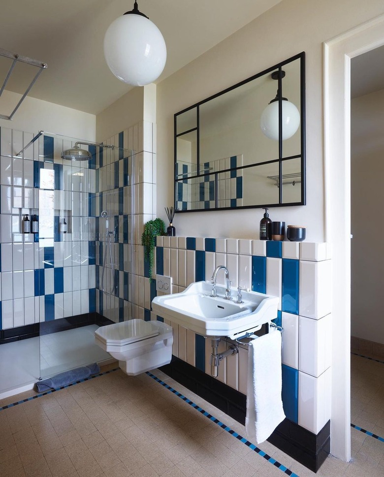 Bathroom with geometric shapes and bold blue and white tiles