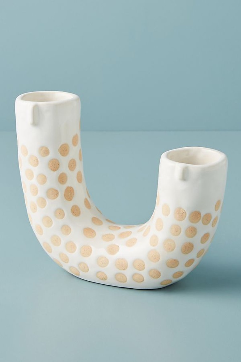 vase in a u shape with details of a face