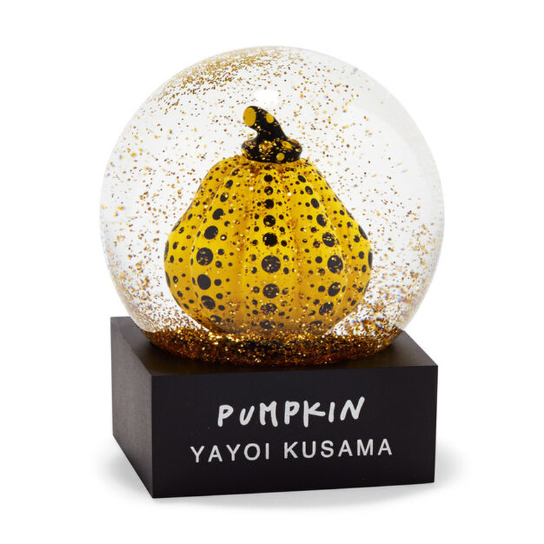 glitter snow globe with yellow pumpkin inside