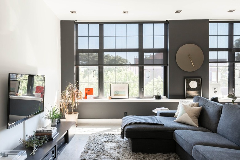 Modern upstairs living space with full length windows