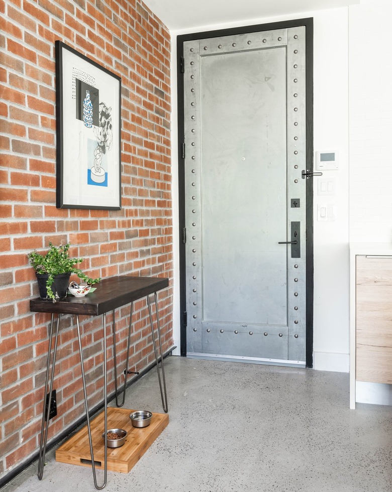 Entryway with brick wall