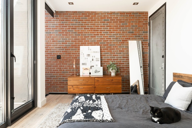 Contemporary bedroom with wood cabinets