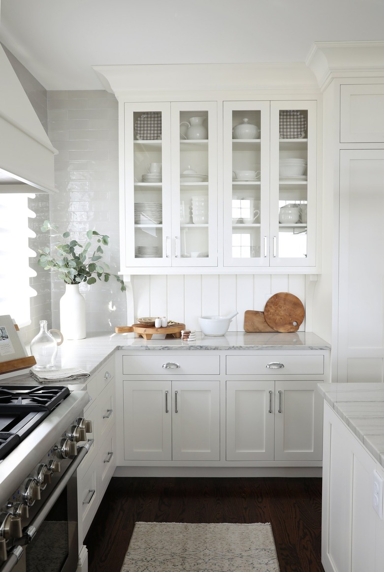 White backsplash with white kitchen cabinets