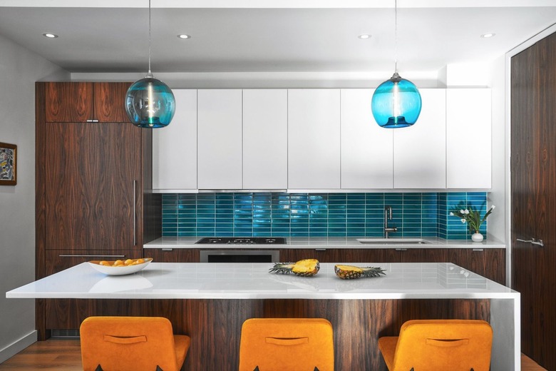 Aqua kitchen backsplash with white kitchen cabinets