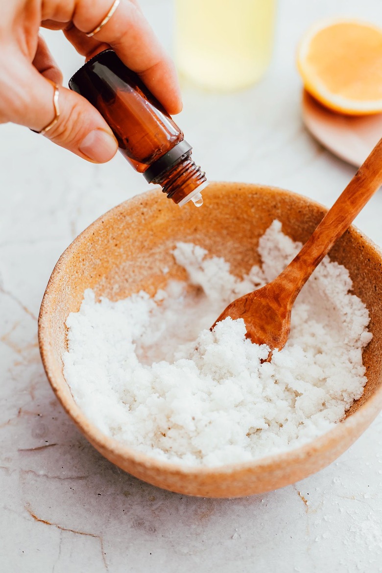 Add essential oils to homemade bathtub scrub mixture