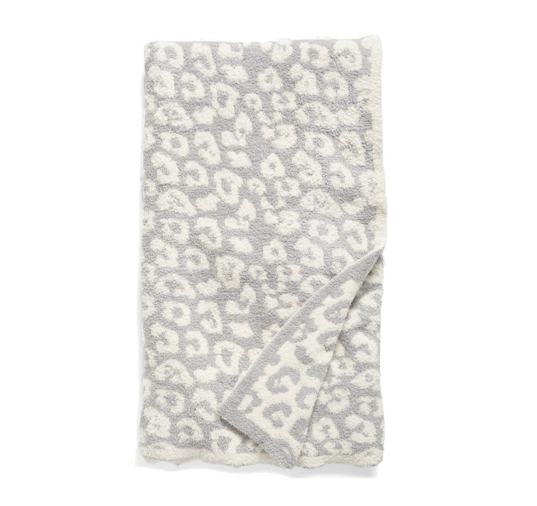 gray and white leopard throw