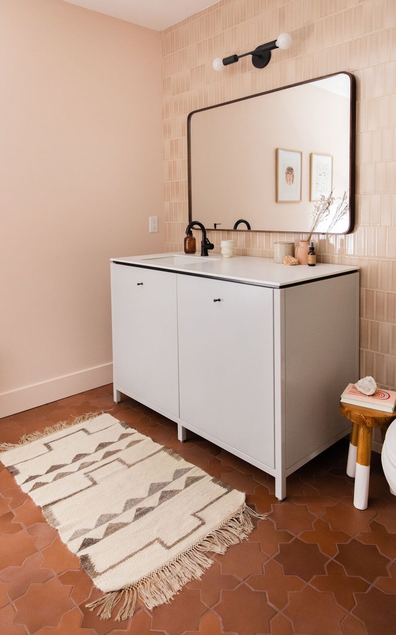 basement bathroom with small vanity cabinet