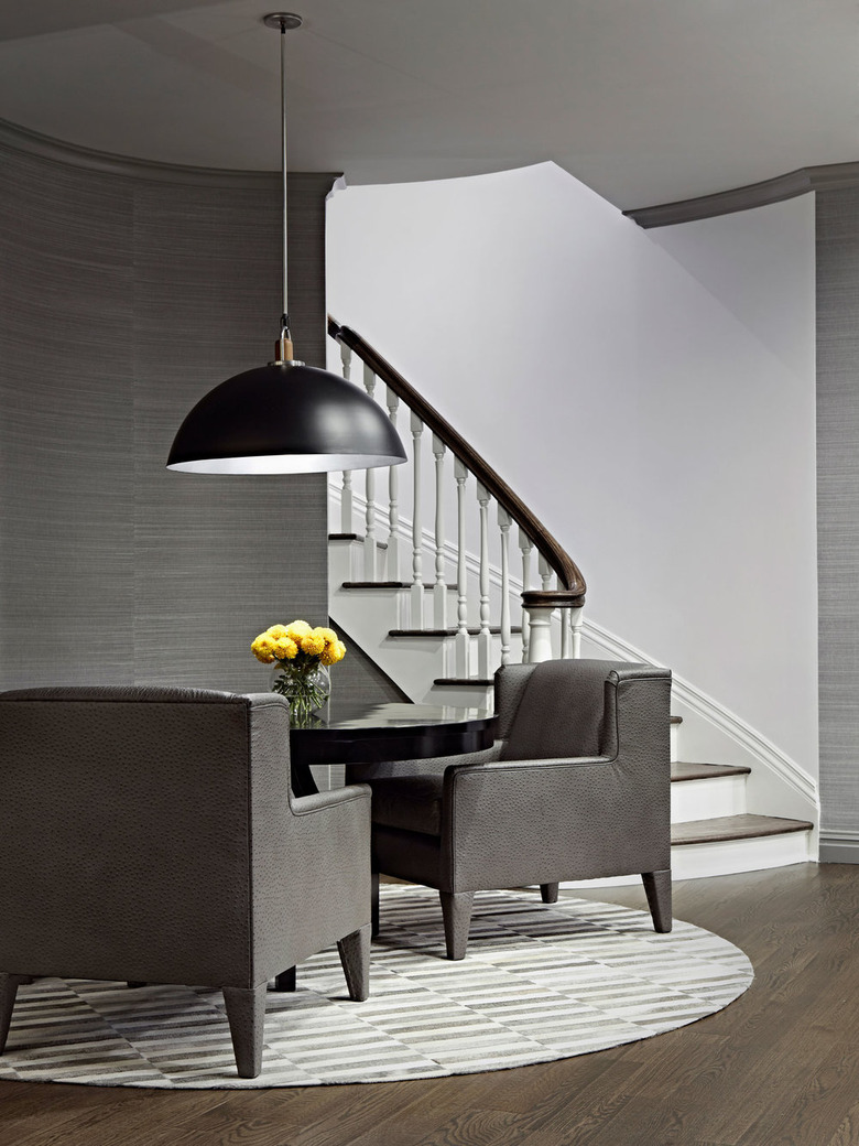 basement furniture with gray chairs and small table