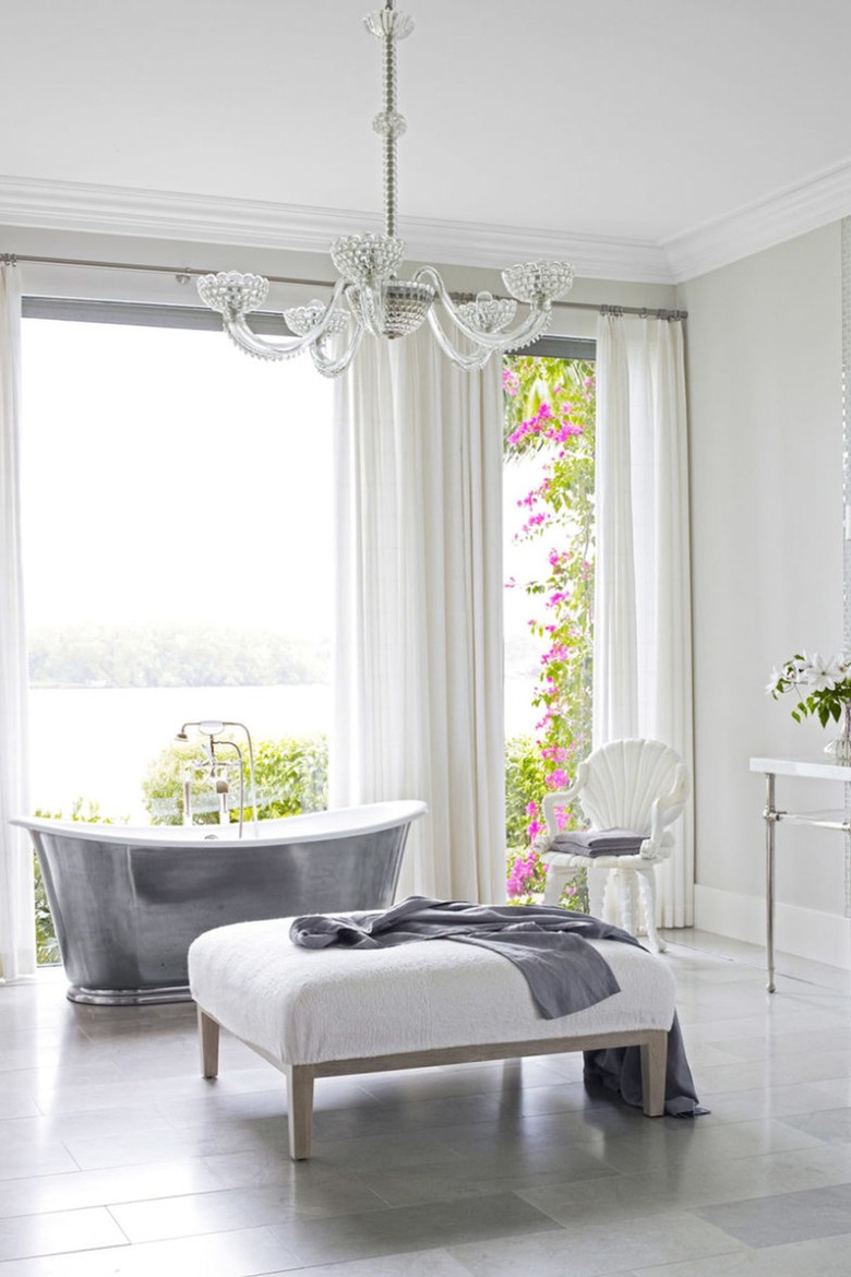 White bathroom with shimmery chandelier
