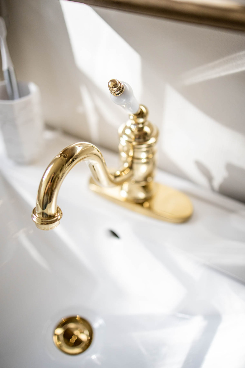 Victorian-inspired brass faucet on bathroom sink