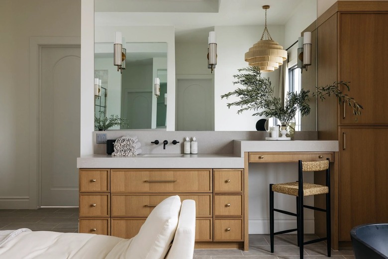 bathroom makeup vanity with frameless wall-to-wall mirror