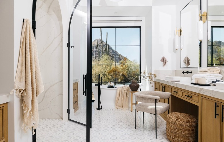 modern bathroom makeup vanity complemented by black fixtures and hardware