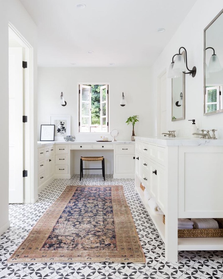 bathroom rug idea in white bathroom and patterned floor tile