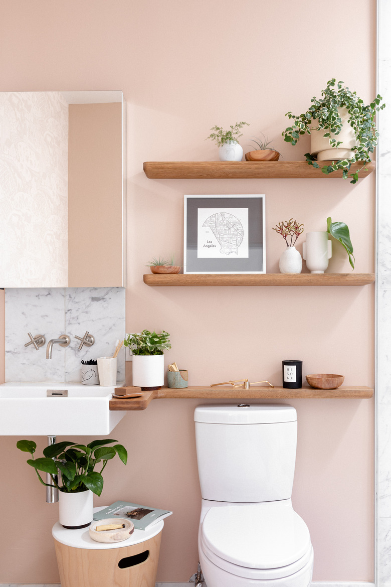 wood shelves over the toilet