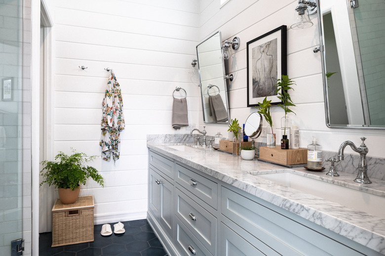 bathroom with white shiplap wall