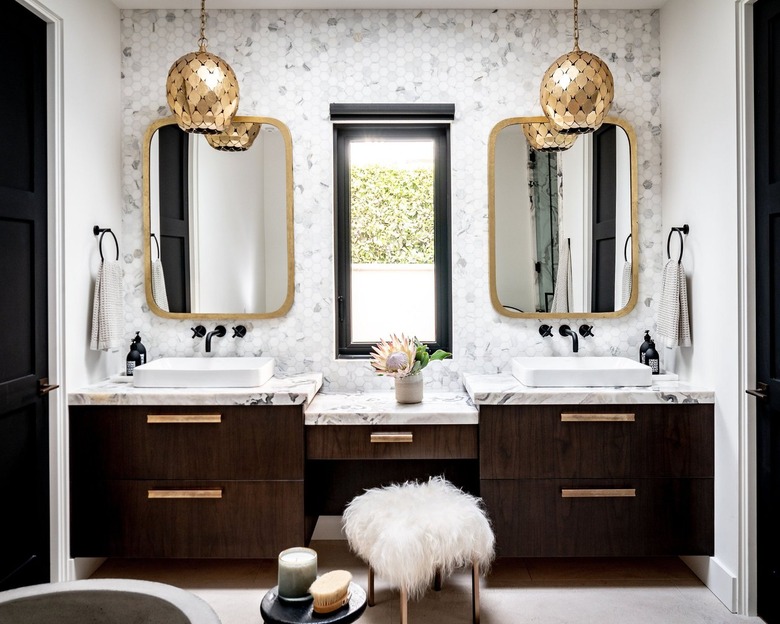 Double vanity glam bathroom with gold pendant lights
