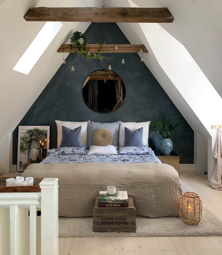 Attic bedroom with beams on the ceiling