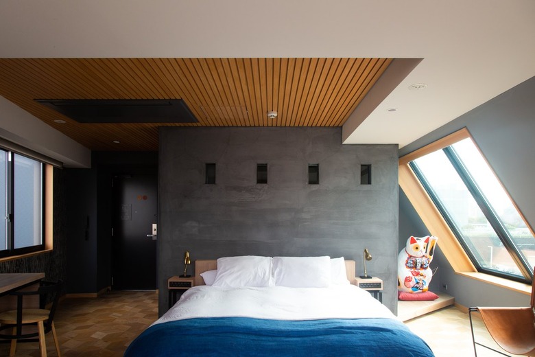 a hotel room with a wooden ceiling