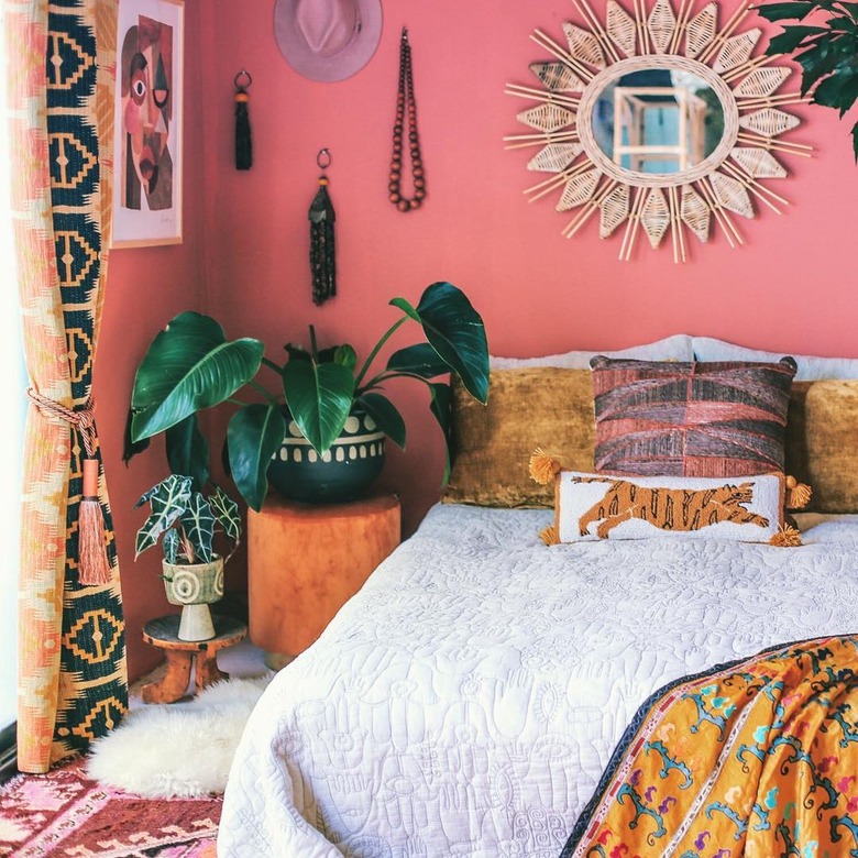 Bedroom with bohemian and global accents in pink