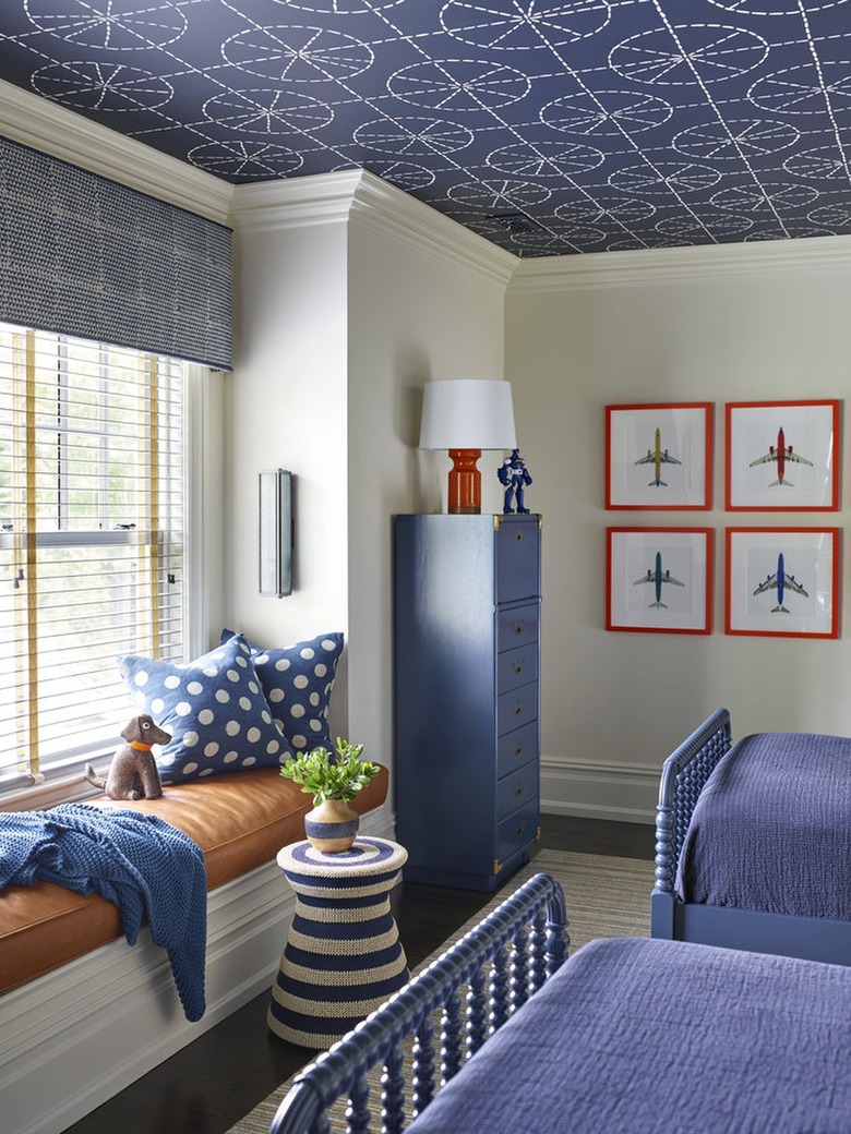Kids' bedroom with blue wallpapered ceiling