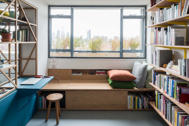 window seat near bookshelves and view of the outside