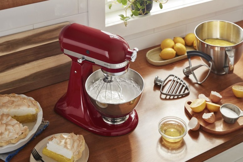 KitchenAid stand mixer making meringue on a kitchen counter