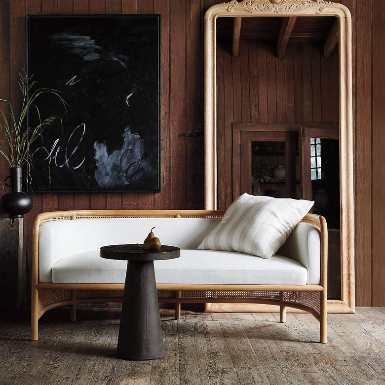 Crate and Barrel Fields Cane Settee With White Cushion by Leanne Ford