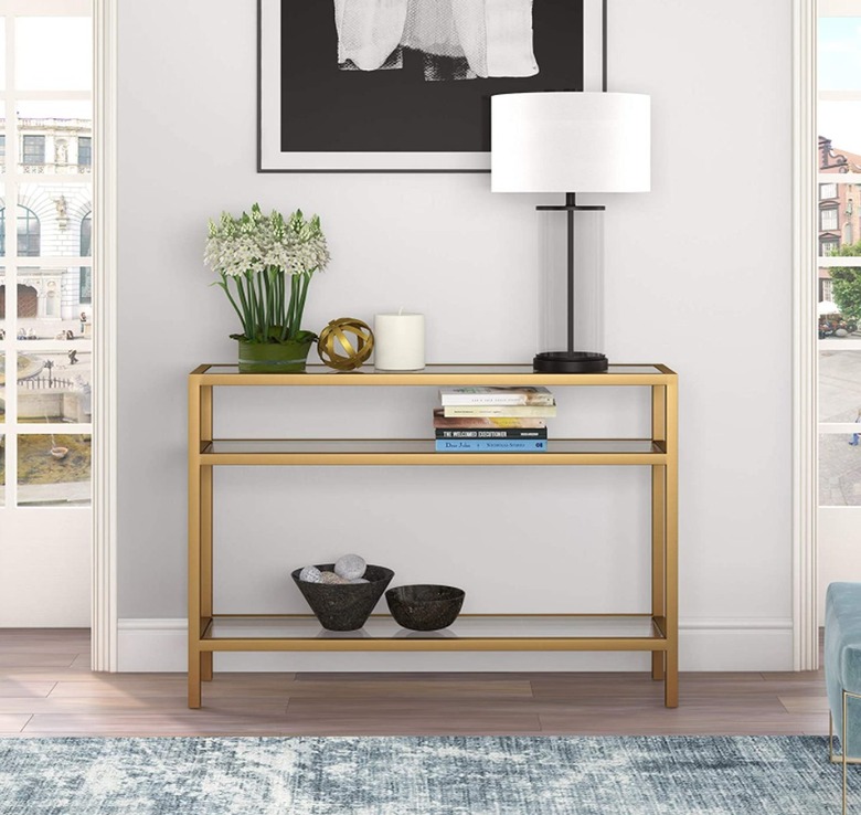 Brass console table with shelves