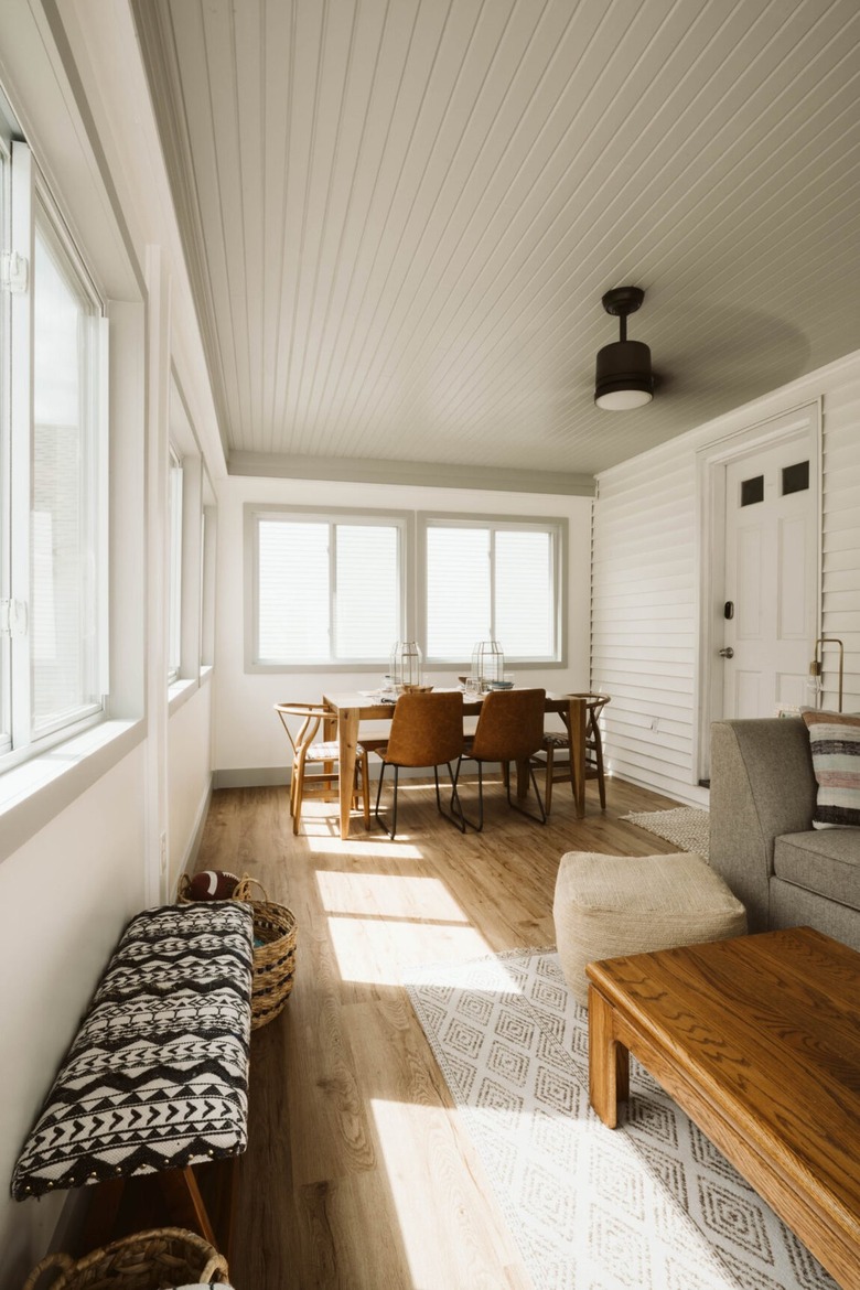 Sunroom with gray shiplap painted ceiling