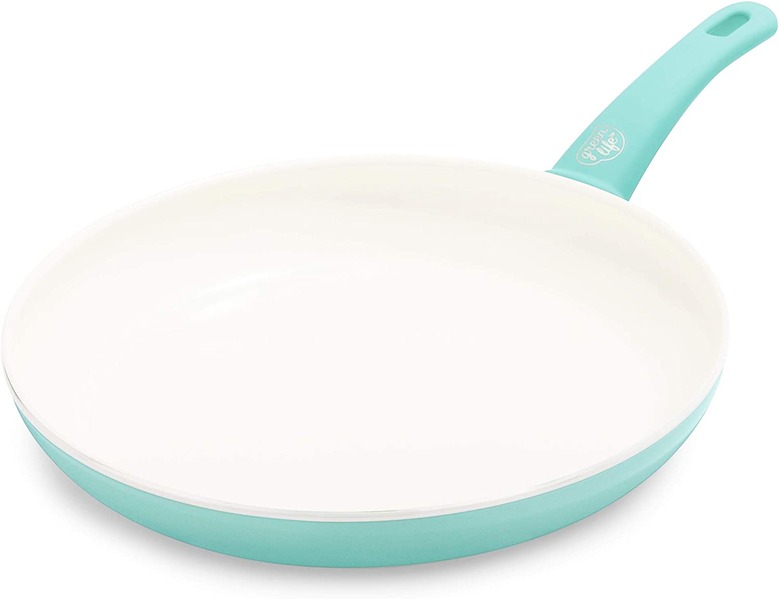 Turquoise frying pan with white interior