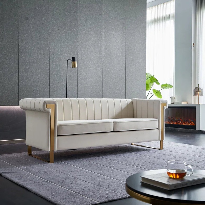 contemporary white and brass chesterfield