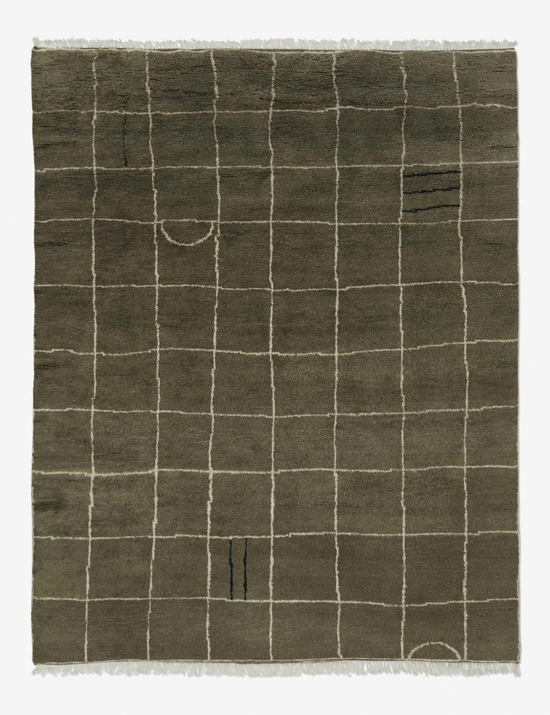irregular grid green rug