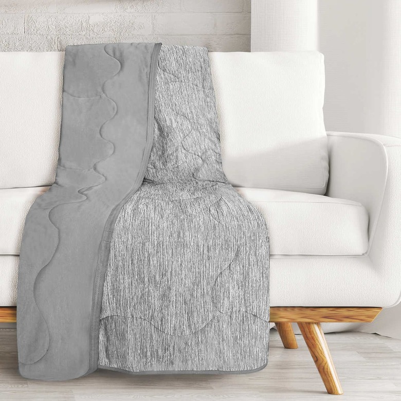 gray throw on white sofa