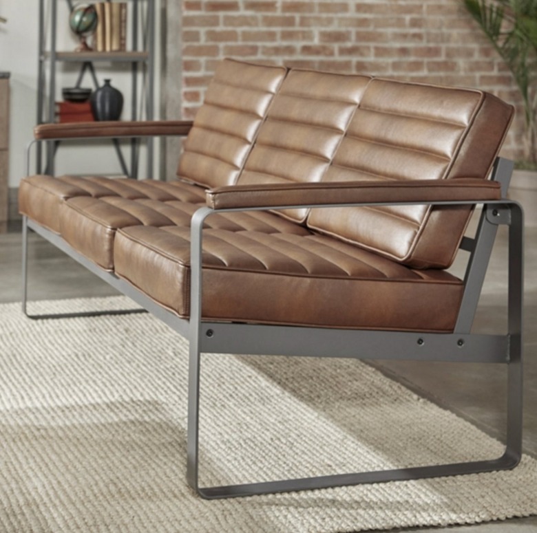 Metal and leather couch in industrial room