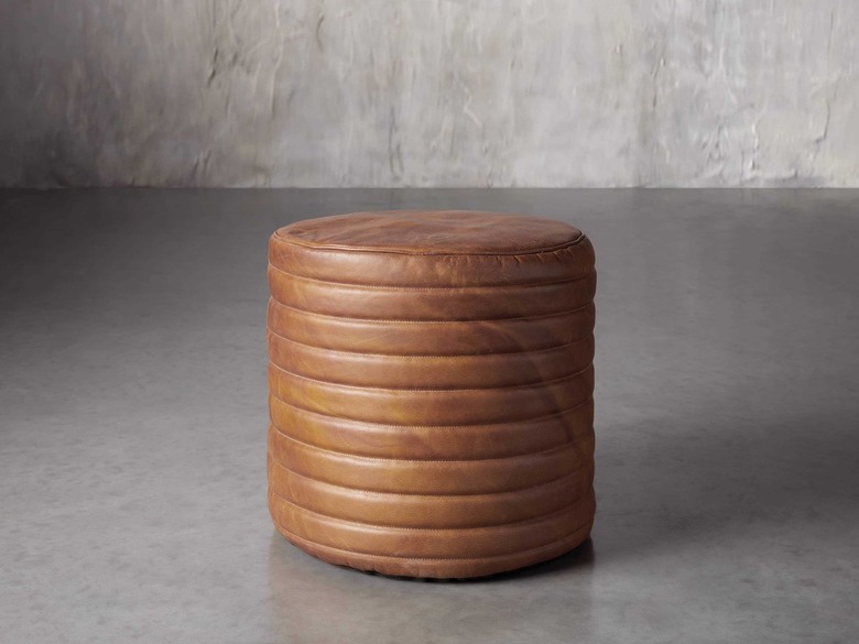 round stitched leather pouf
