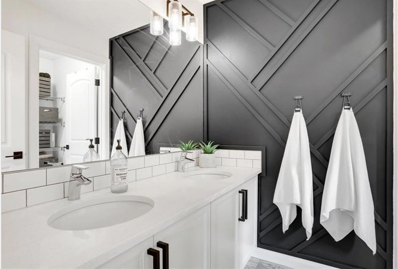 charcoal neutral colors on accent wall in white bathroom