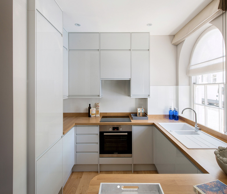 Light blue neutral colors in kitchen with wood floor