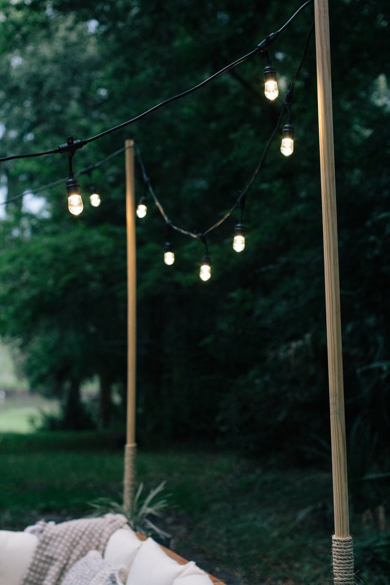 Outdoor string lights with wood poles