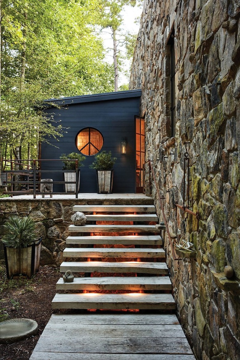 house with stone steps lit by step lights