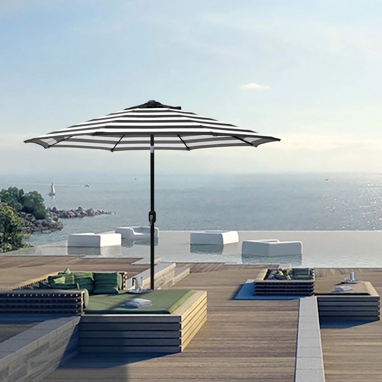Striped umbrella by pool