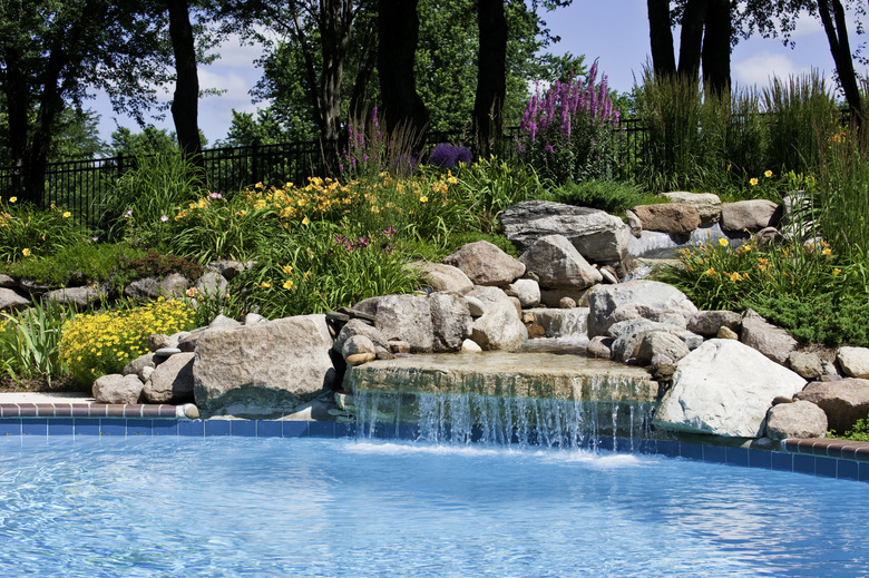 The beautiful poolside of a waterfall with rocks