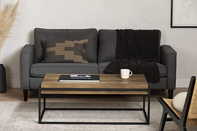 metal and wood coffee table in front of gray couch