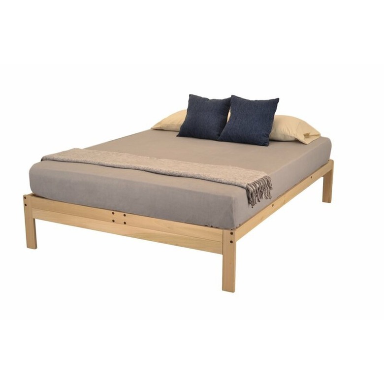 Union Rustic Aidean Solid Wood Bed with brown sheet