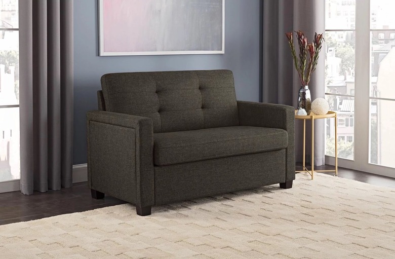 gray sleeper loveseat with tan rug